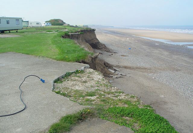 Ulrome, East Riding of Yorkshire, England. No place for a caravan. At least, not any longer. The photograph looks north along the clifftop to "Highlands".