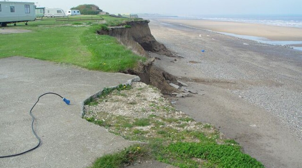 Ulrome, East Riding of Yorkshire, England. No place for a caravan. At least, not any longer. The photograph looks north along the clifftop to "Highlands".