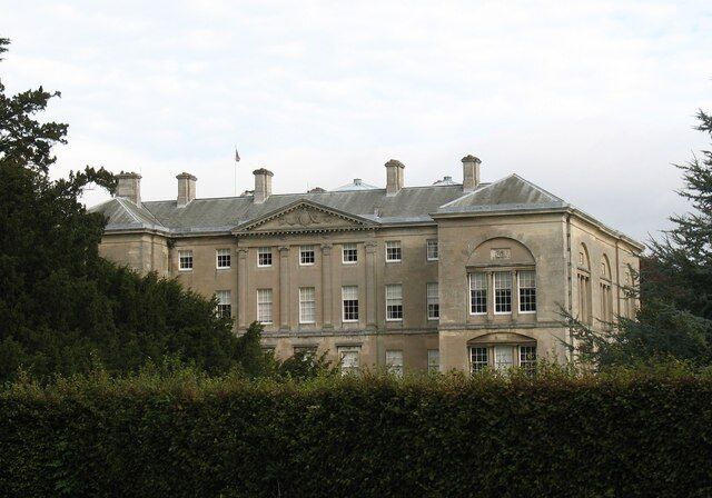 Sledmere House from the churchyard, Sledmere, East Riding of Yorkshire, England. The south west side of this grand country house, most of which dates to the time of Sir Christopher Sykes who remodelled and enlarged the house in the late 18th century in a very restrained and elegant style.