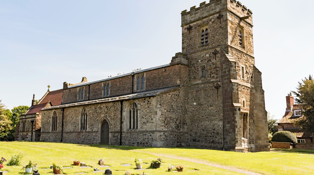 The church dates from the twelfth century onwards, with a 12-13th century chancel, nave with clerestory and north and south aisles, with arcades of five bays and round piers. There is also a western tower, south porch and north vestry. The church is built with Holderness cobbles and limestone from Tadcaster, as well as mediaeval brick. The 13th C. tower is of three stages with a crenellated parapet. There are fragments of t12th C. stonework in the tower, including a reset scratch dial. There are two bells, one dating from the late fourteenth century. The north and south arcades date from the 13th century with one octagonal pier to the north. The chancel arch dates from the fifteenth century. The chancel has a twelfth century blocked priest's door and a squint. The church was enlarged on several occasions in the Middle Ages, in the thirteenth century when the aisles and arches of the nave were enlarged, the fourteenth century when the chancel and porch were enlarged and the fifteenth century when the aisle windows were altered and the clerestory windows added. The tower had decayed by around 1600 and was repaired, but by the mid 19th century the church had deteriorated badly. The chancel was repaired in 1884 and major restoration was carried out from 1889 to 1892 by W. S. Weatherley. This was followed by further work in 1897. There are two Memorial brasses from the fourteenth century. The church has several stained-glass windows.