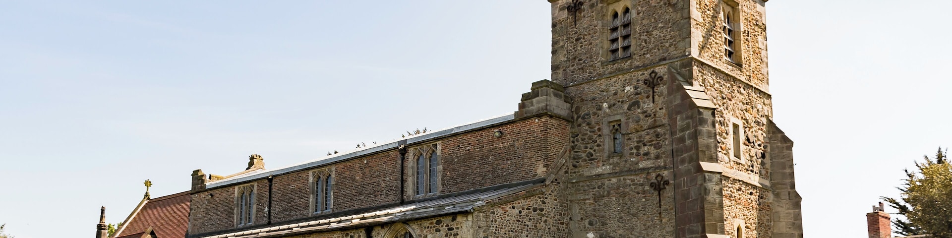 The church dates from the twelfth century onwards, with a 12-13th century chancel, nave with clerestory and north and south aisles, with arcades of five bays and round piers. There is also a western tower, south porch and north vestry. The church is built with Holderness cobbles and limestone from Tadcaster, as well as mediaeval brick. The 13th C. tower is of three stages with a crenellated parapet. There are fragments of t12th C. stonework in the tower, including a reset scratch dial. There are two bells, one dating from the late fourteenth century. The north and south arcades date from the 13th century with one octagonal pier to the north. The chancel arch dates from the fifteenth century. The chancel has a twelfth century blocked priest's door and a squint. The church was enlarged on several occasions in the Middle Ages, in the thirteenth century when the aisles and arches of the nave were enlarged, the fourteenth century when the chancel and porch were enlarged and the fifteenth century when the aisle windows were altered and the clerestory windows added. The tower had decayed by around 1600 and was repaired, but by the mid 19th century the church had deteriorated badly. The chancel was repaired in 1884 and major restoration was carried out from 1889 to 1892 by W. S. Weatherley. This was followed by further work in 1897. There are two Memorial brasses from the fourteenth century. The church has several stained-glass windows.