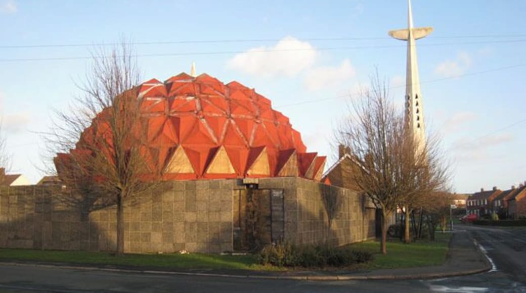 Church of Christ the King, Bowburn. Oliver Dixon writes at Geograph: "Built in 1976, this striking futuristic church stood in the former mining village of Bowburn. Unfortunately, it suffered serious design faults and was closed in September 2004. At the time of photography the building was in a sorry state with the roof in a poor state of repair, and the whole premises fortified like Fort Knox against vandals. The building was demolished in May 2007, just leaving the cross standing." Update taken from the website www.christthekingchurch.co.uk The Church of Christ the King is the Parish Church (C of E) serving the three villages of Bowburn, Cassop and Quarrington Hill with members of the congregation drawn from all three villages and beyond. A new multi purpose church building and hall was dedicated, after enormous efforts from the congregation, in September 2008, on the site of the old building (once famous in the area as 'the pineapple church'). Worship is in the Catholic tradition of the Church of England within which all are welcome and made to feel at home. The Bishop of Beverley (the Provincial Episcopal Visitor for the Northern Province), the Rt. Revd. Glyn Webster has pastoral and sacramental care of the parish, which is in the Diocese of Durham. The celebration of the Mass (Eucharist or Holy Communion) is at the centre of the parish's worshipping life both on Sundays and in the week. Morning or Evening Prayer is also said daily (Mondays excepted) by the parish priest with others and all are welcome to join in. During the Sunday Mass a small but active Sunday School meets in the hall. On Thursday evenings our parish branch of the Church Lads and Church Girls Brigade, a uniformed organisation for young people aged 5 and upwards, meets in the Church Hall. There is a very active programme of social and fundraising events: fairs, quizzes, suppers etc., normally once a month at which all are welcome. The church hall is available for hire for one off or regular functions normally at £11 per hour. Bookings for Baptisms, Marriages, Banns etc. can normally be made at church on a FRIDAY 5.30PM-6PM. Full details of weekly services, socials and special events can be found on the weekly news sheet or on the notice board outside church.