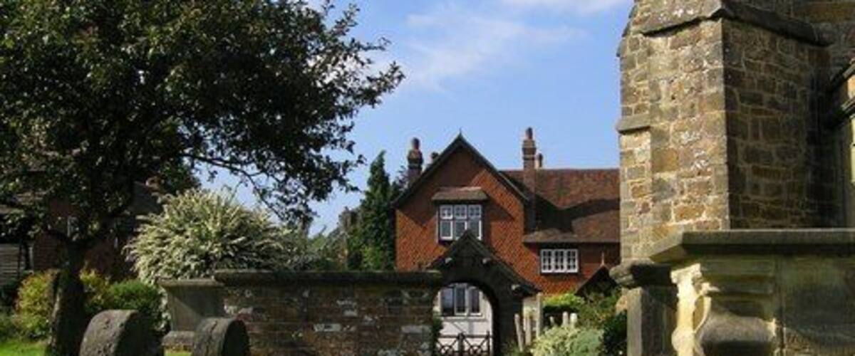 St Margaret's Churchyard, West Hoathly A glimpse of the Cat Inn through the churchyard of St Margaret's, West Hoathly
