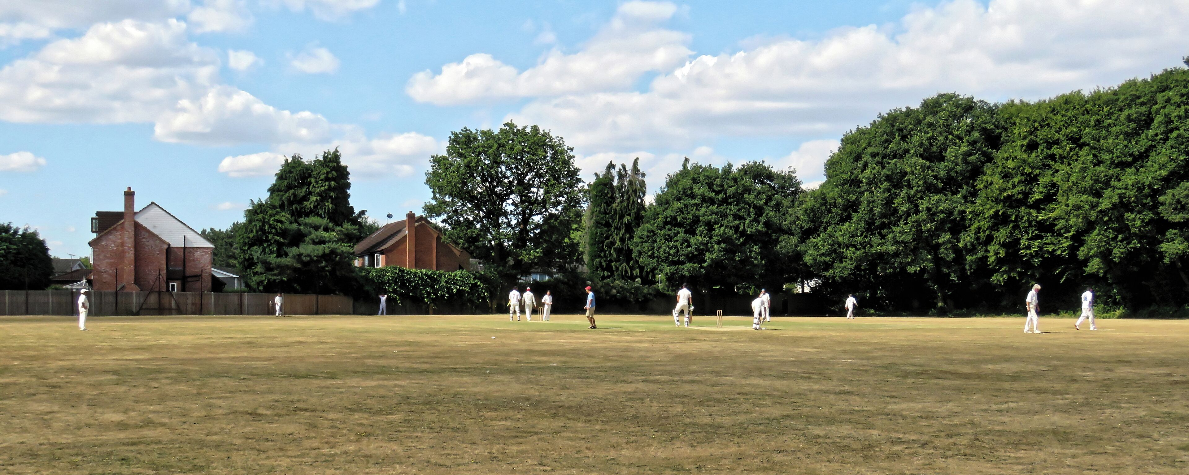 A public Sunday friendly match between Coopersale CC and Old Sectonians CC (Coopersale batting), at Coopersale, a village northeast from Epping, Essex, England. Coopersale Cricket Club, although previously running Saturday teams, today play only Sundays friendlies. Old Sectonians Cricket Club is a long-standing peripatetic club from Ilford, London. Camera: Canon PowerShot SX60 HS Software: File lens-corrected, optimized, perhaps cropped, with DxO PhotoLab, and likely further optimized with Adobe Photoshop CS2.