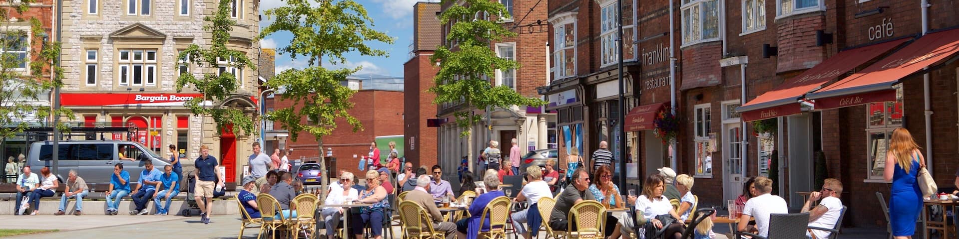 Exmouth which includes street scenes, a coastal town and outdoor eating