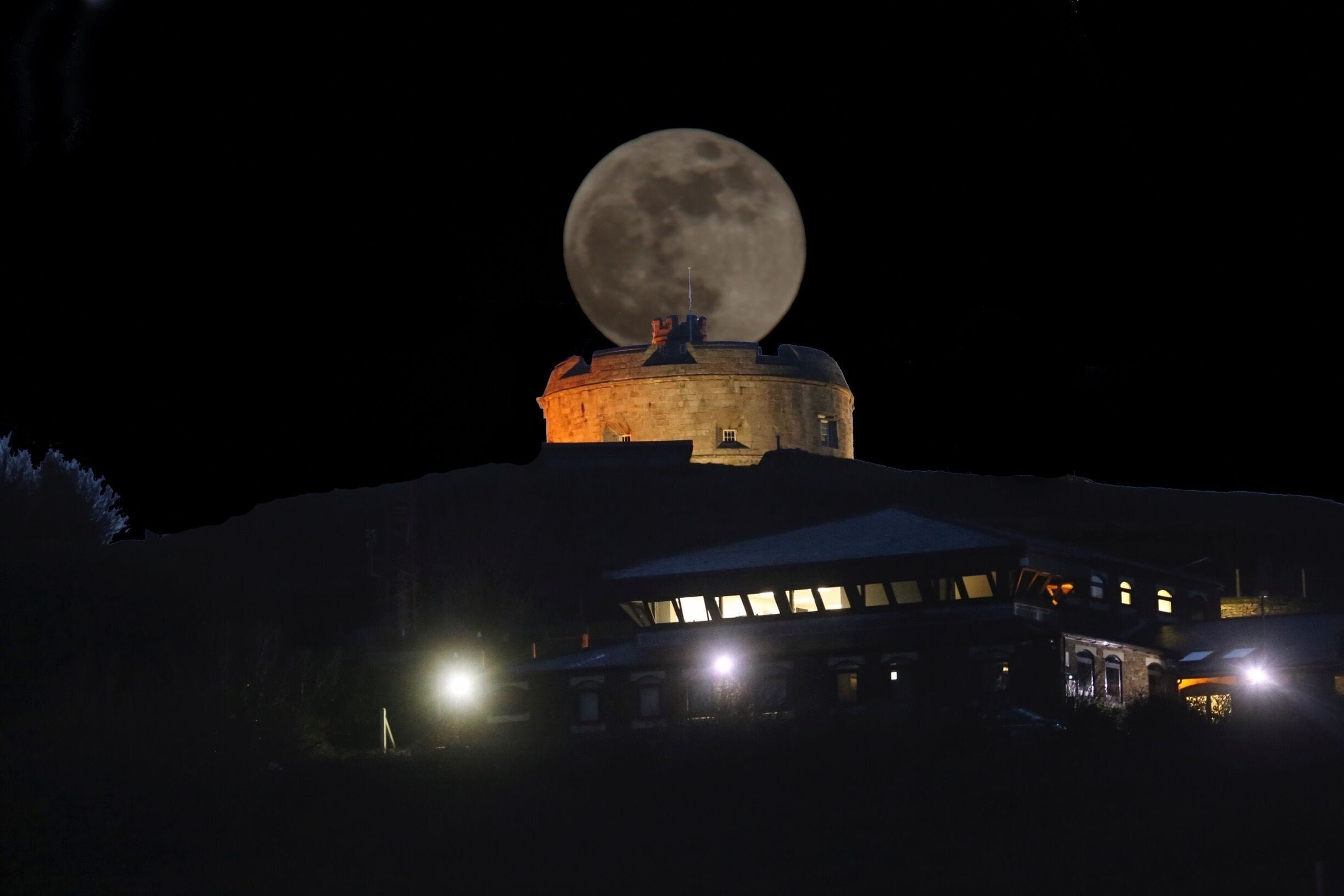 Blue super moon over Falmouth Coastguard watch station, Falmouth bay