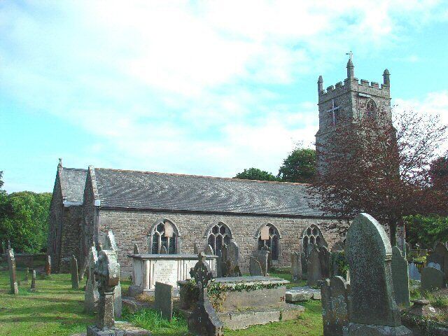 A historic church with a tall tower and arched windows.