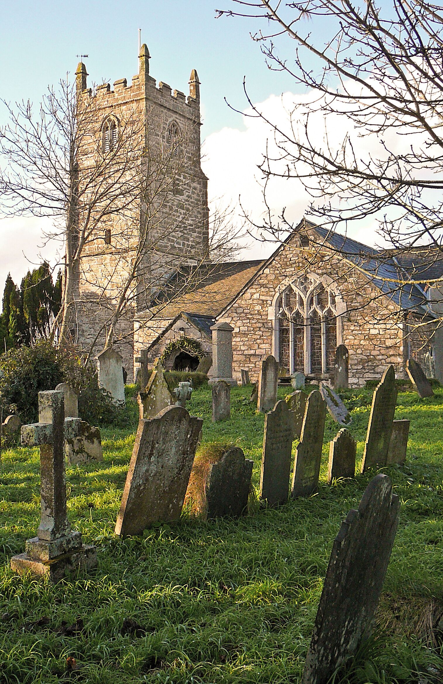 A historic church with a tall tower and Gothic windows.
