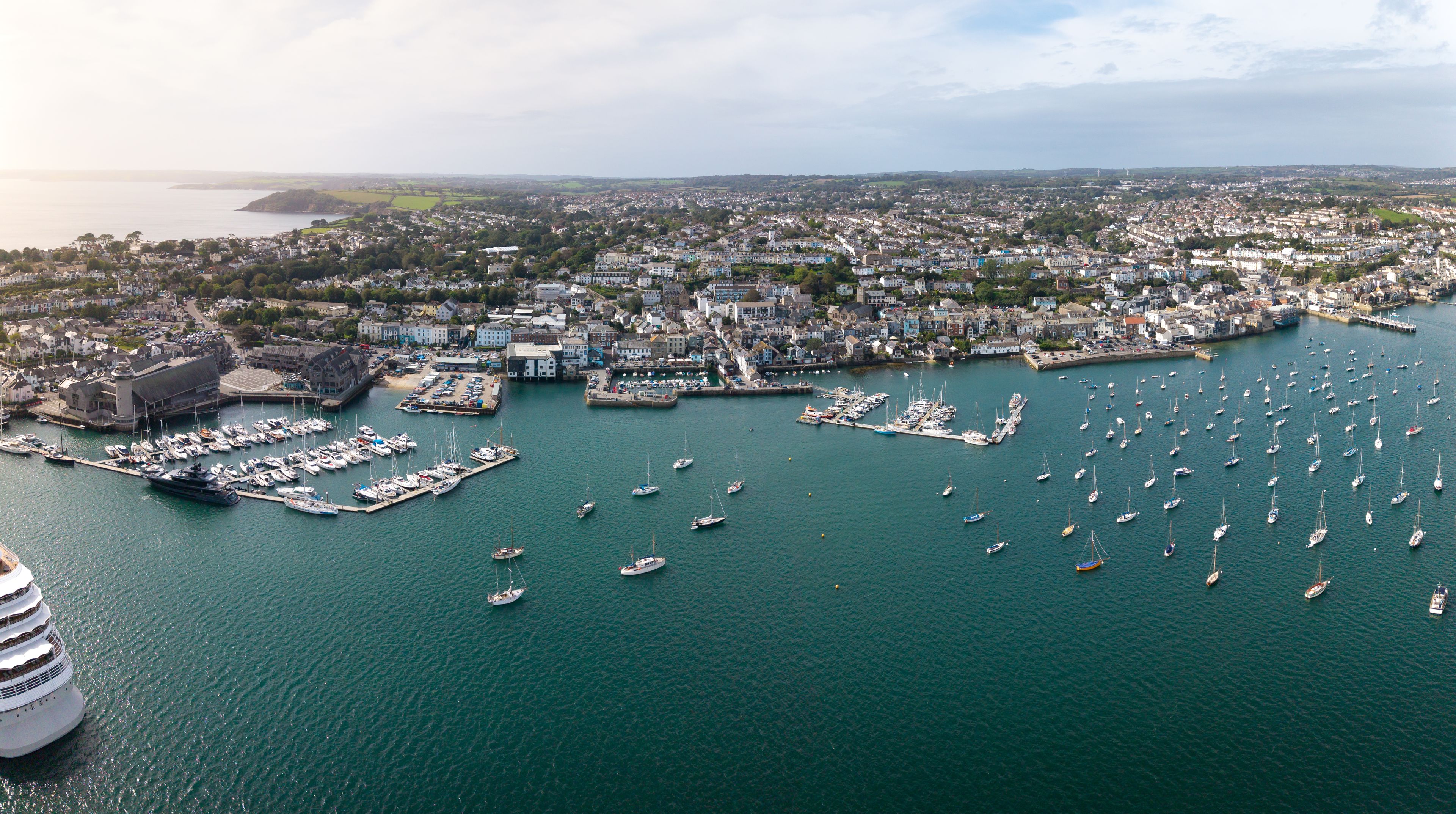 Aerial panorama of Falmouth townscape in Cornwall, UK with marina and sailing boats