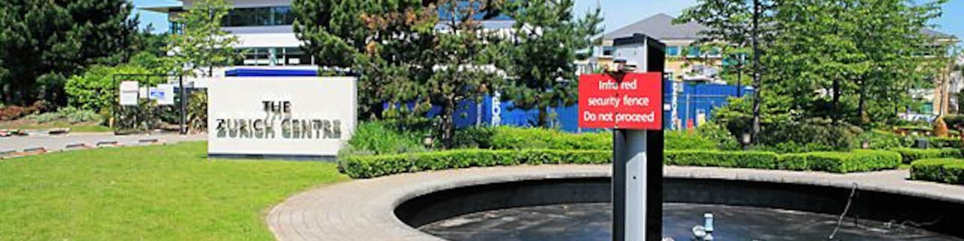 The Zurich Centre, Parkway in the Solent Business Park The Solent Business Park is quite intimidating, with lots of notices saying private, don't do this, and don't do that. Here we have an infrared beam around Zurich Life Assurance's offices. The road is however a public highway.