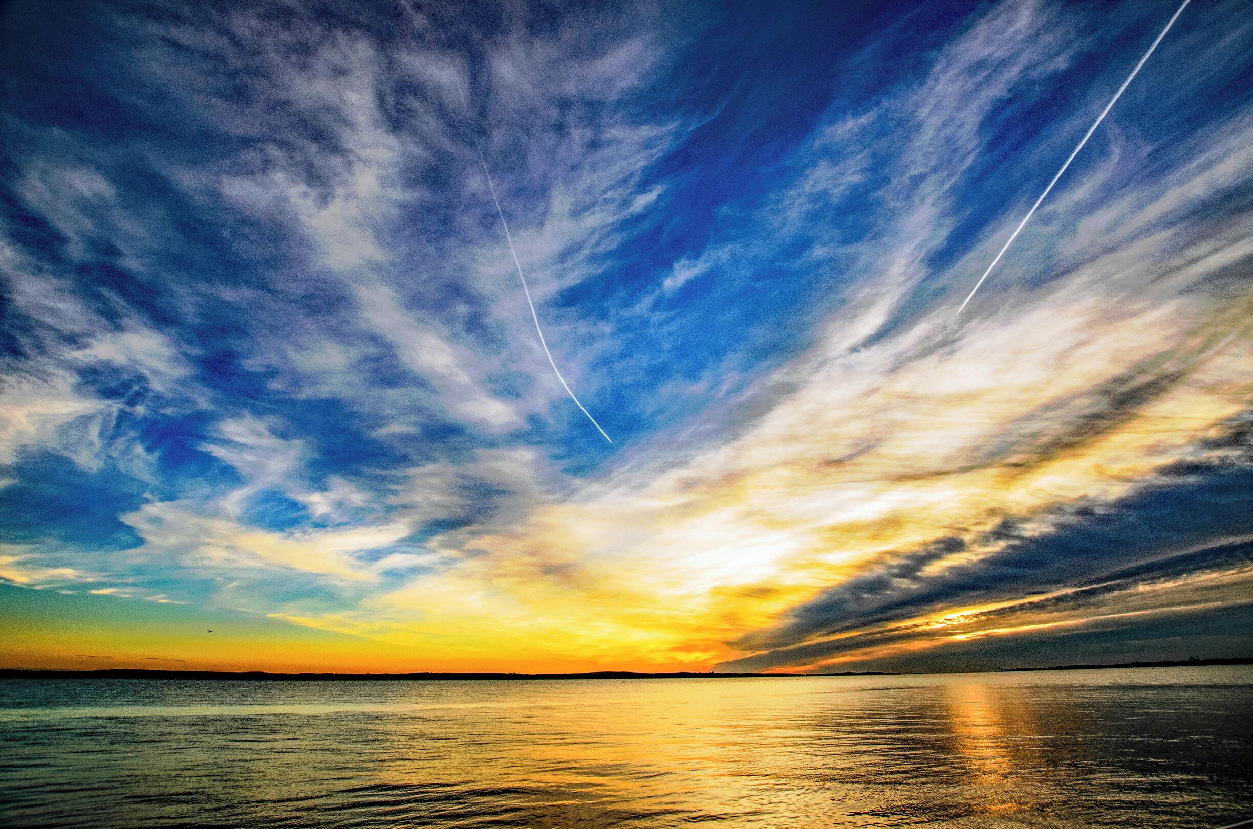 View across the Solent looking towards the Isle of Wight and Calshot. Ample free beach parking and dog friendly walks.