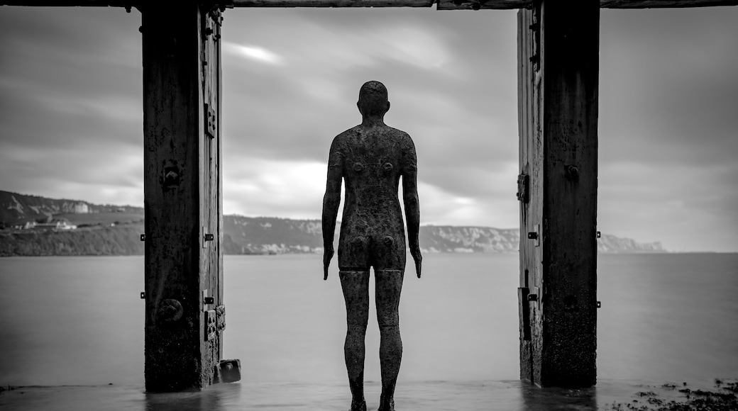 Gormley statue at the Folkestone Harbour Arm in Kent. Using a long exposure to smoothe the sea and sky to a degree.