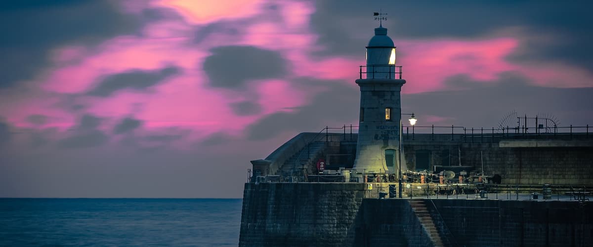 Photo taken from the beach opposite the harbour arm. Very little editing. Beautiful sunrise and location.