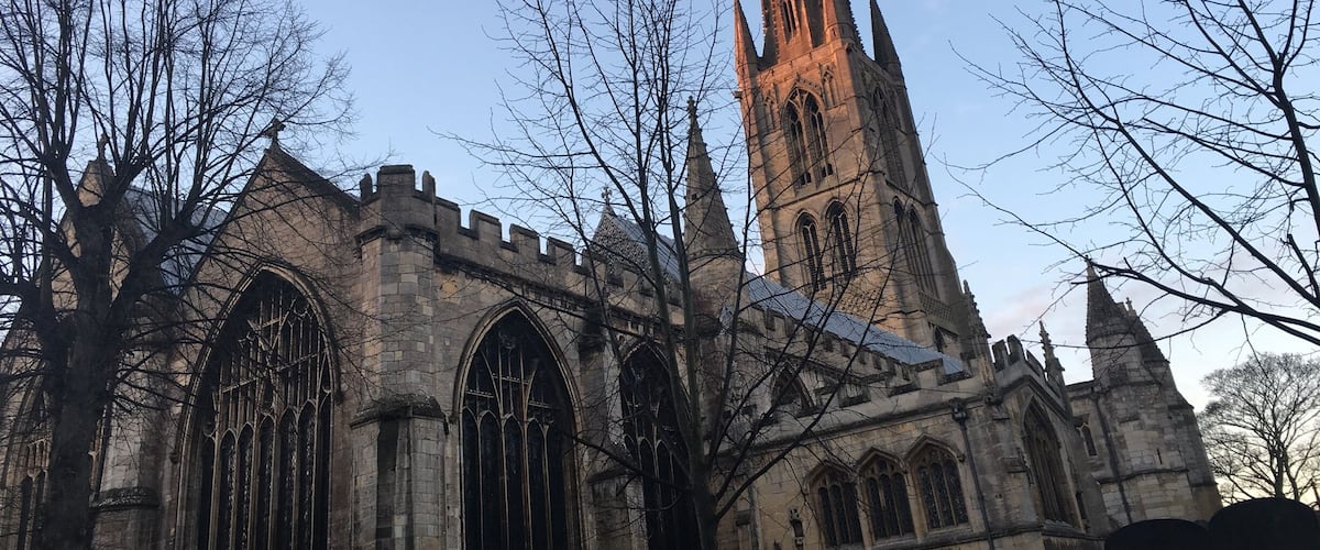 A historic church with tall spires and large arched windows.