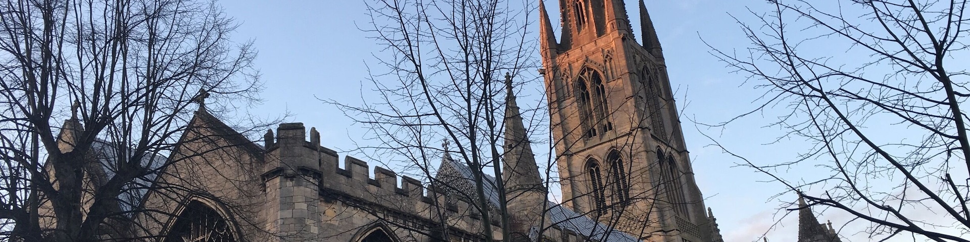 A historic church with tall spires and large arched windows.