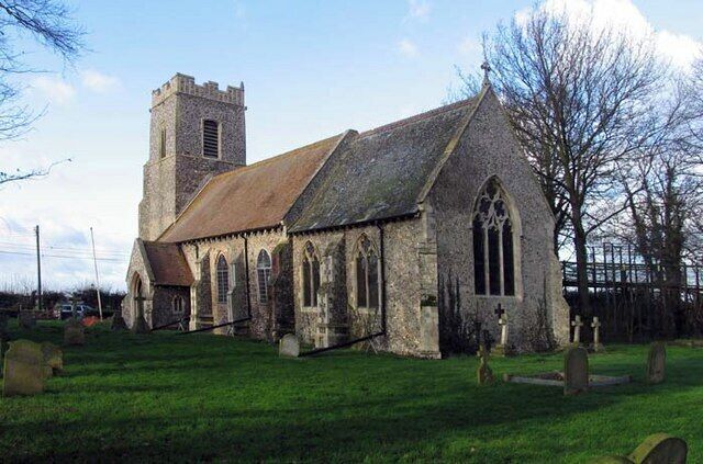 A historic church with a tower and arched windows.
