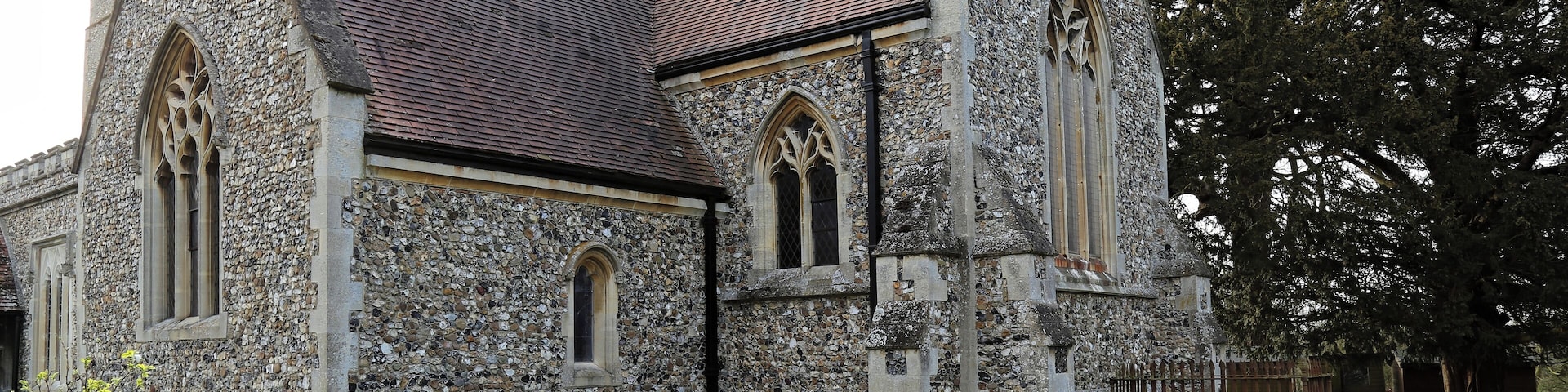 View from the churchyard towards the south-east of the south transept and chancel of the Grade: II* listed early 13th-century St Mary the Virgin parish church of Matching, Essex, England. Software: file lens-corrected and optimized with DxO OpticsPro 10 Elite and Viewpoint 2, and further optimized with Adobe Photoshop CS2.