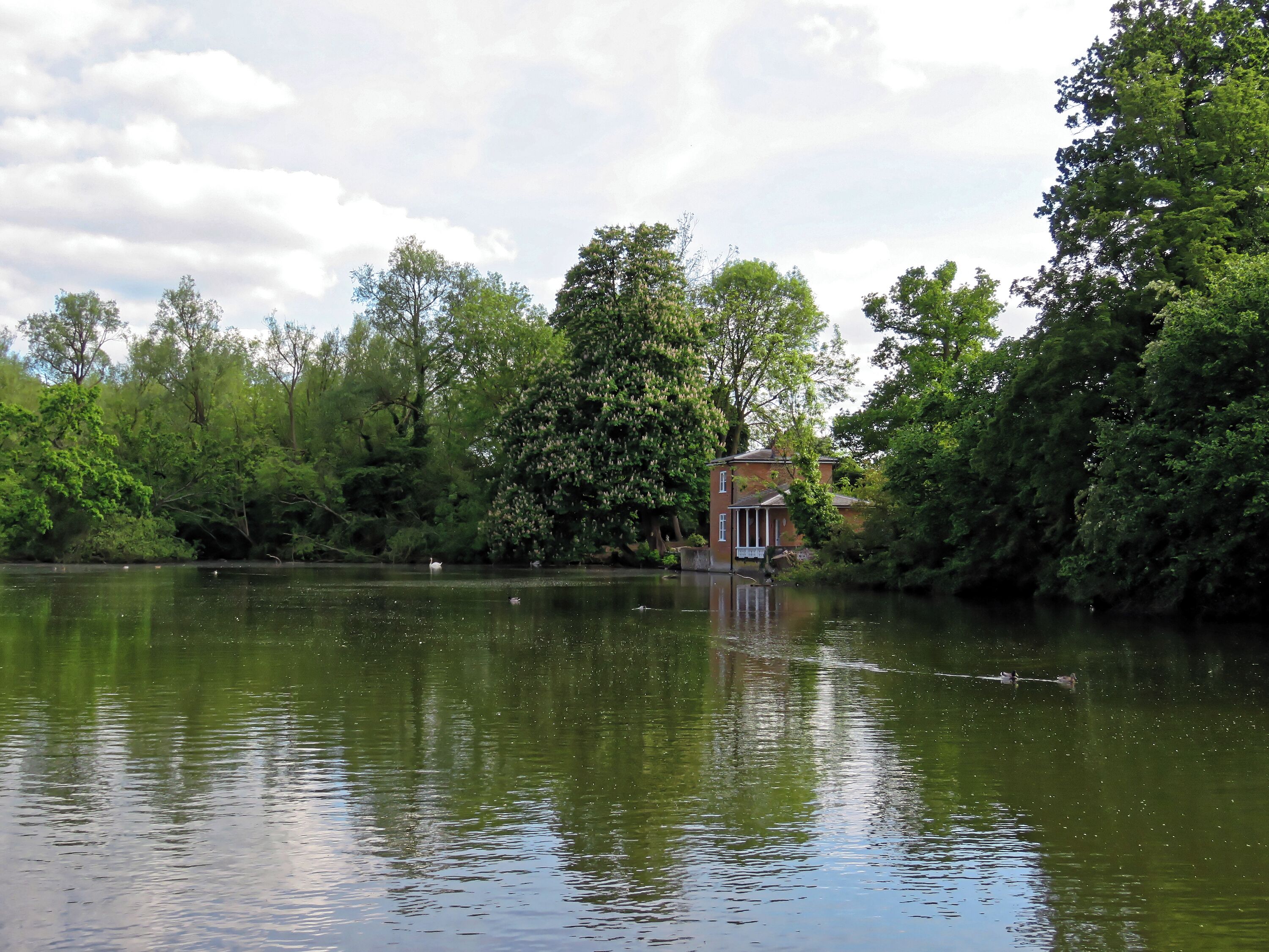 The Grade II listed mid-19th-century Lilypond Cottage estate fishing lodge on an artificial lake to the north-east of St Mary's Parish Church in the civil parish of Matching, in Essex, England. Camera: Canon PowerShot SX60 HS Software: File lens-corrected, optimized, perhaps cropped, with DxO OpticsPro 11 Elite, and likely further optimized with Adobe Photoshop CS2.