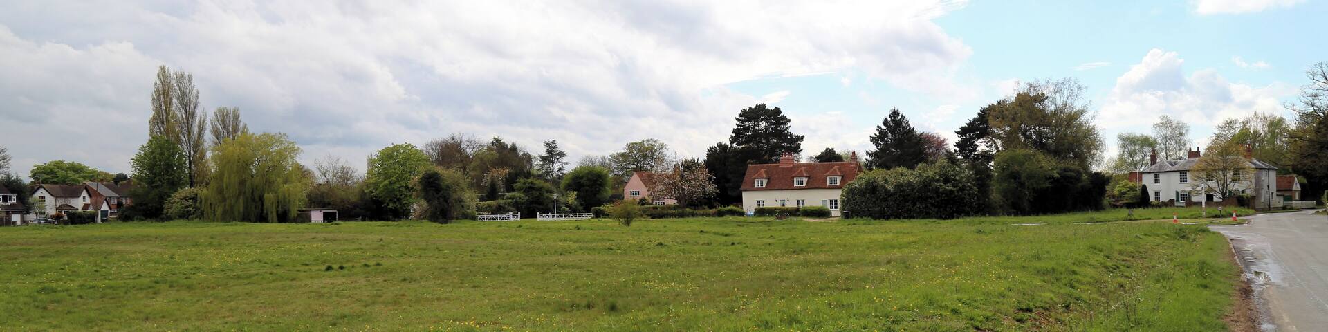 Across the village green from the east at Matching Green, Essex, England