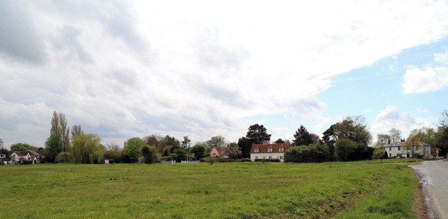 Across the village green from the east at Matching Green, Essex, England