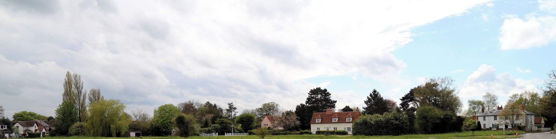 Across the village green from the east at Matching Green, Essex, England