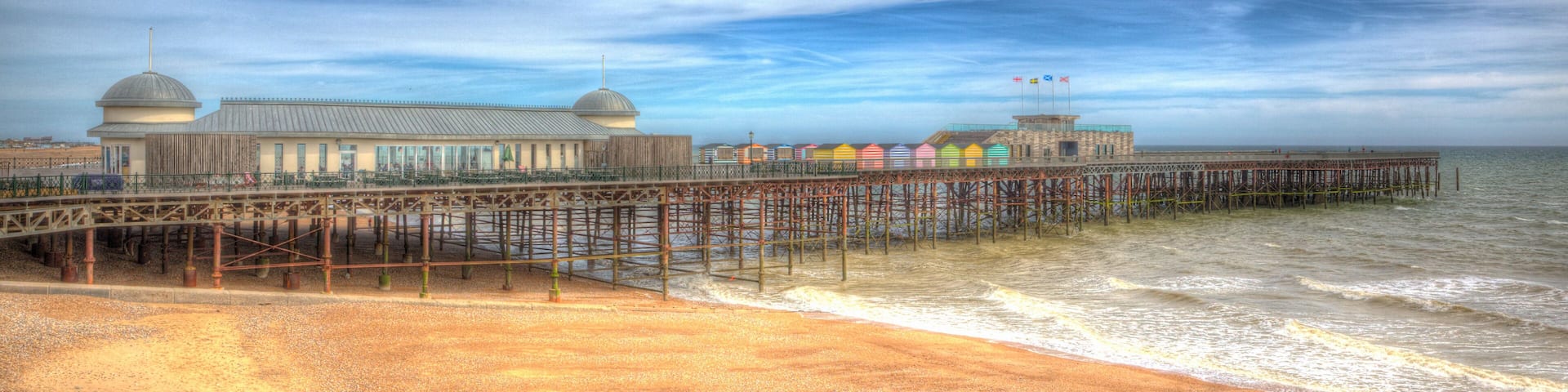 Hastings beach and pier East Sussex England UK in colourful HDR panoramic view