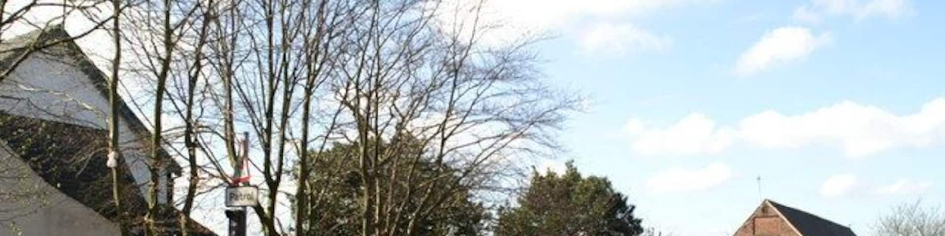 St James' Parish Centre (right) and part of the parish church (left), Church Road, Haydock, Merseyside, seen from the northeast