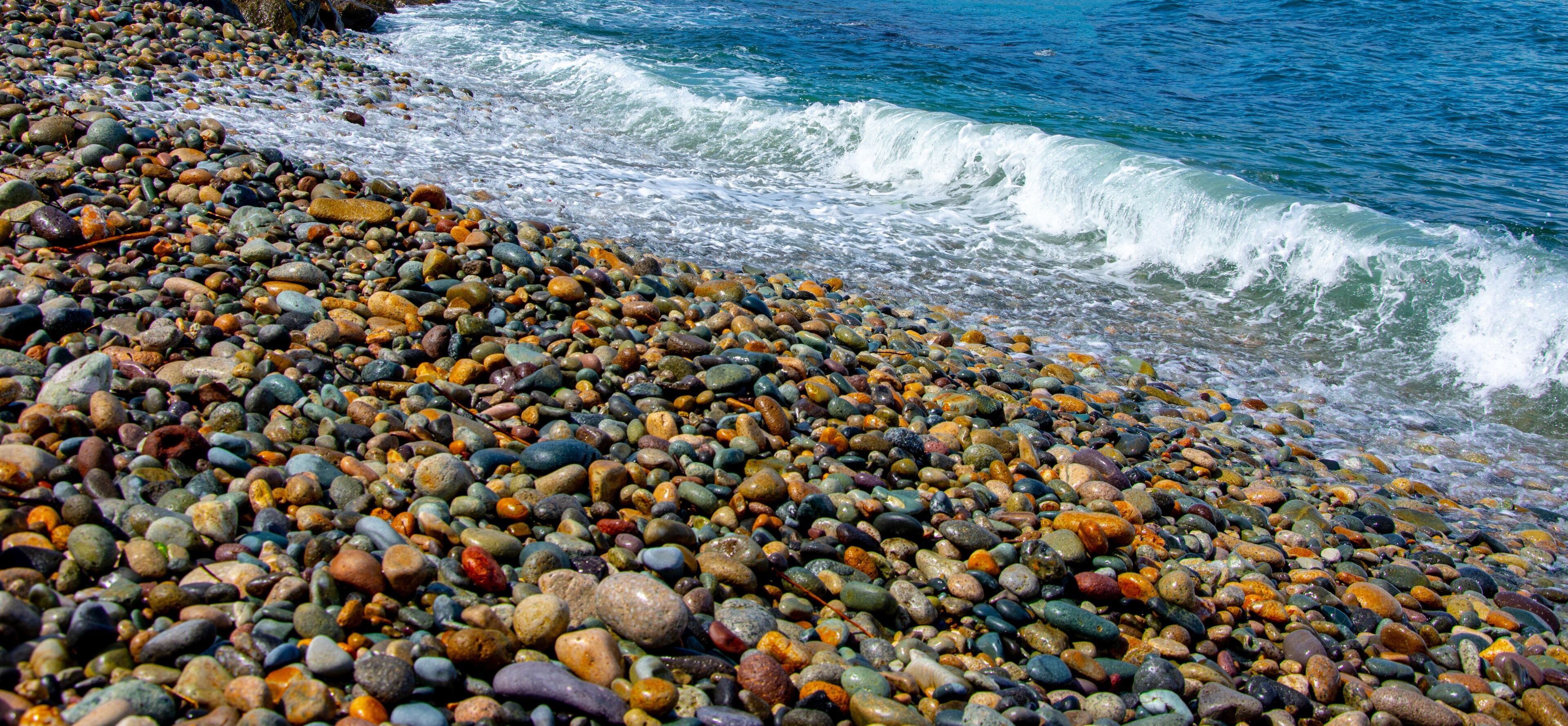 The waves of the Black sea hitting the rocks on the beach in city of Giresun