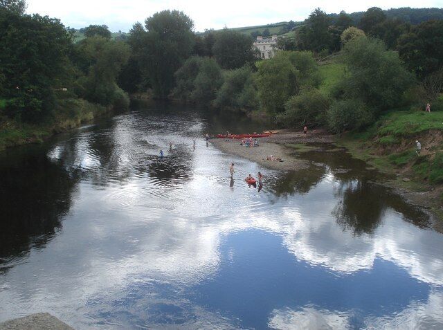 River Wye and Bredwardine vicarage Looking downstream from Bredwardine bridge. Between the trees is Bredwardine vicarage, built in 1805 and sitting on the same terrace above the Wye as the parish church. These terraces may be the site of a vineyard which was recorded as adjacent to the castle in the 13th century. Reverend Francis Kilvert lived in the vicarage from 1877-9 and his diary makes many references to the site.