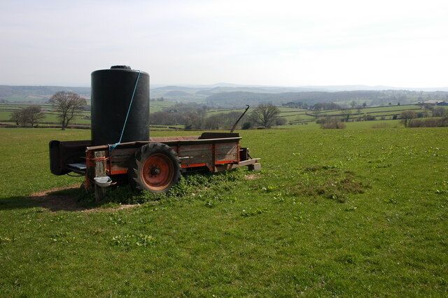 Farmland to the south of Wern William Farm, near Upper Maes-Coed, Herefordshire, Great Britain. This old muck spreader has assumed a new life, that of a water carrier. Immediately to the east of this spot the 1/25,000 OS map indicates a wood, however the land is now a field.