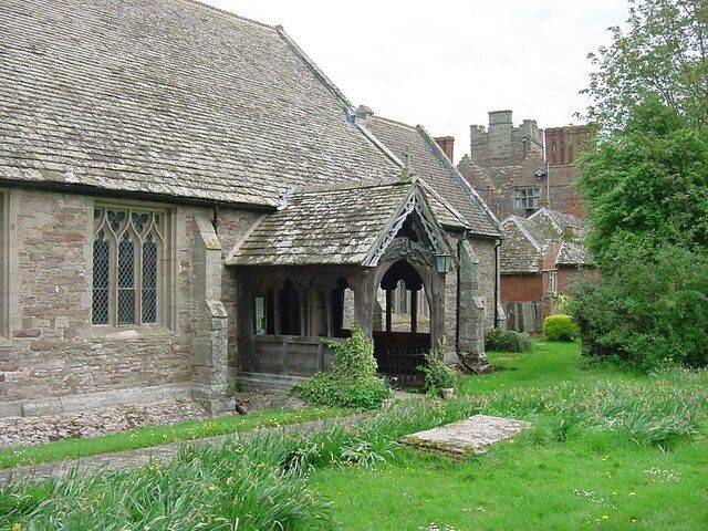 Kinnersley - St James Church Entrance porch and main door. Kinnersley Castle in the background.