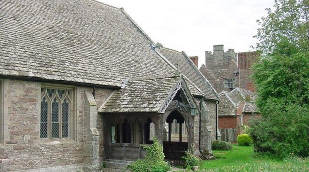 Kinnersley - St James Church Entrance porch and main door. Kinnersley Castle in the background.
