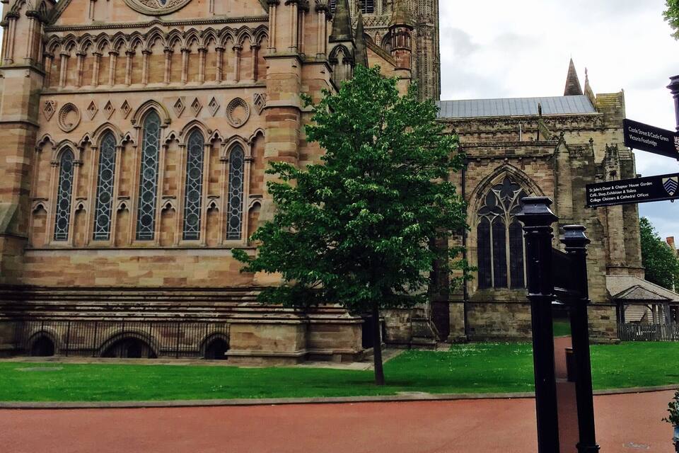 A historic church with pointed arches and a large rose window.
