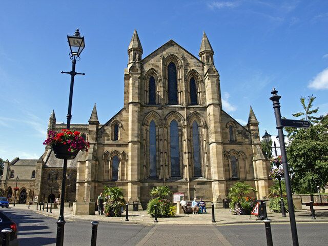 A historic church with tall spires and large arched windows.