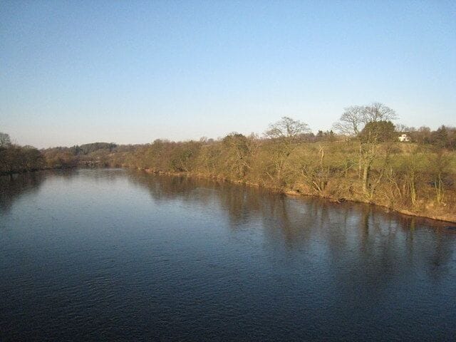 View north from Wark Bridge This photograph shows a view of the River North Tyne as it flows in a southerly direction from Kielder reservoir pass the small village of Wark in Northumberland. The picture was taken from Wark Bridge looking in a northerly direction towards Gold Island.