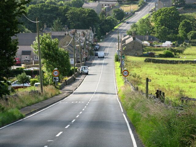 Entering West Woodburn from the North along the A68 Looking down the hill towards West Woodburn.