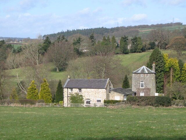 Former windmill, Acomb. There was also a water mill on the 1269402; Pevsner says that "the millstream was insufficient to turn the internal overshot wheel in dry summers, so the watermill {now also a private house - MQ} was operated first probably in conjunction with the windmill on the hill to the south and then in the 19th C with a steam engine on the gable wall. The windmill, now part of Lanthorn Cottage, retains a round, tapered three-storeyed tower with chamfered windows and a doorway dated 1720, with the initials RR (Richard Ridley)."