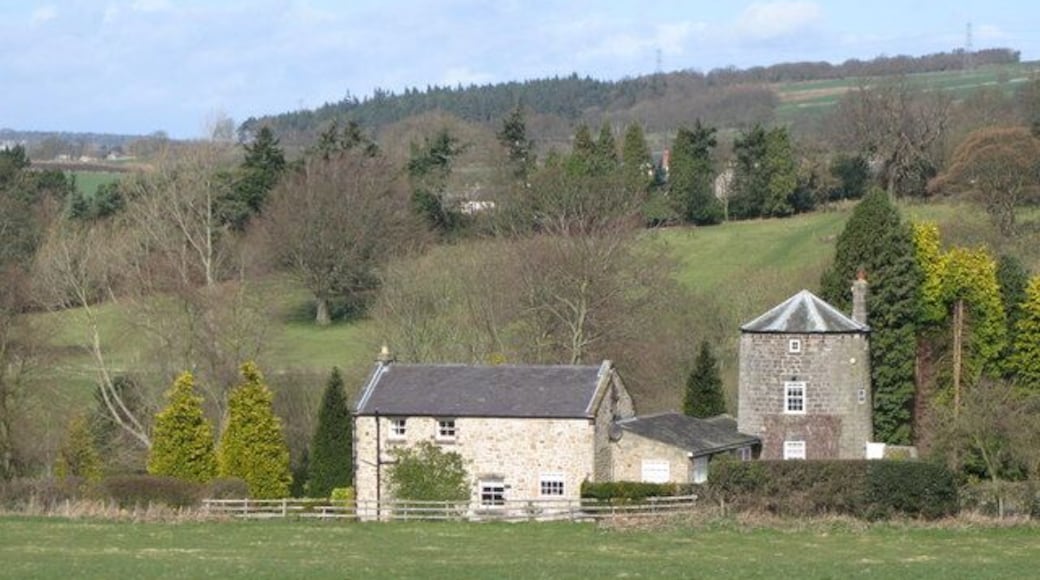 Former windmill, Acomb. There was also a water mill on the 1269402; Pevsner says that "the millstream was insufficient to turn the internal overshot wheel in dry summers, so the watermill {now also a private house - MQ} was operated first probably in conjunction with the windmill on the hill to the south and then in the 19th C with a steam engine on the gable wall. The windmill, now part of Lanthorn Cottage, retains a round, tapered three-storeyed tower with chamfered windows and a doorway dated 1720, with the initials RR (Richard Ridley)."
