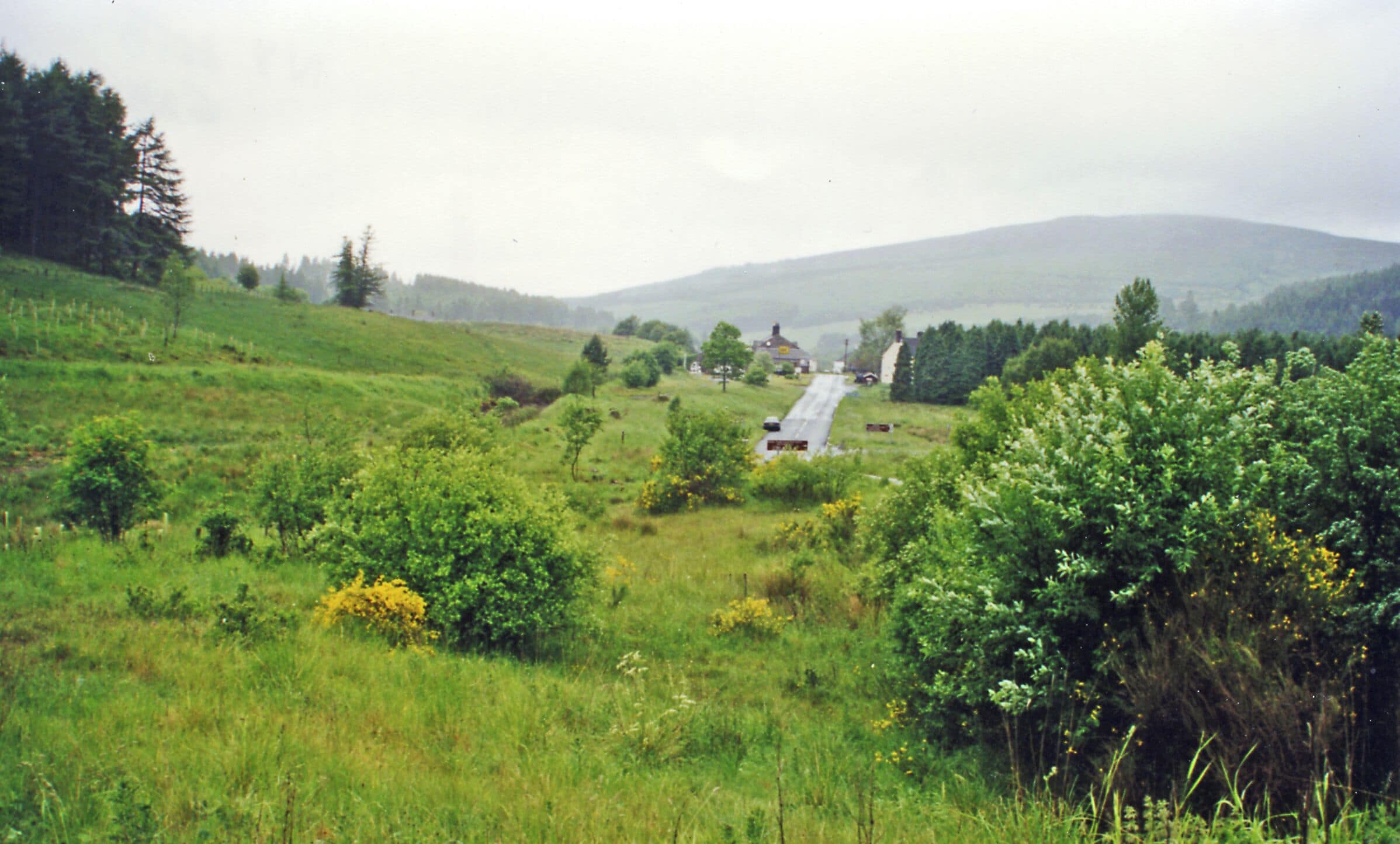 Approaching site of former Kielder Forest station, 2000. View to headwaters of River North Tyne, towards Riccarton Junction on the ex-NBR Hexham - Bellingham - Riccarton Junction (Border Counties) line. The station site is ahead, it and the line having been closed 15/10/56 to passengers, 1/9/58 to goods.