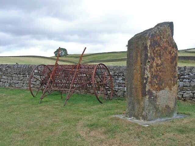 Monumental stone and old rake at Greenhaugh, Northumberland, Great Britain. Not sure what the stone commemorates, if anything, but these two artifacts stand by the roadside at the north end of the village.