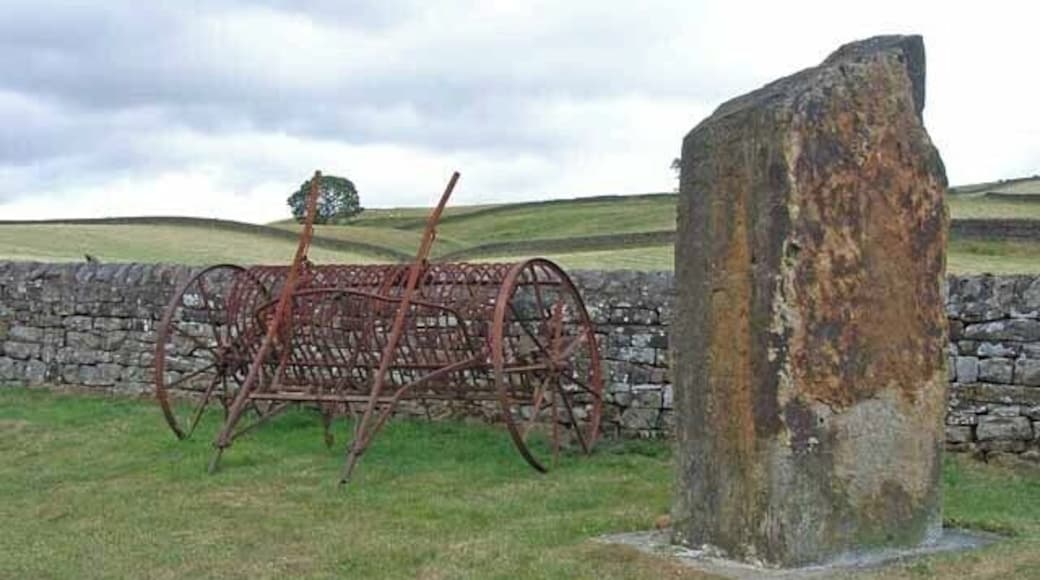 Monumental stone and old rake at Greenhaugh, Northumberland, Great Britain. Not sure what the stone commemorates, if anything, but these two artifacts stand by the roadside at the north end of the village.