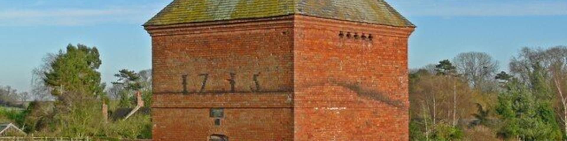 Dovecote in Aston Flamville A plaque on the front of the dovecote reads: This building was restored in 1977 by the Powner family of Aston Flamville in co-operation with the Blaby district council. It lies in a small field next to Lychgate Lane. The dovecote is dated to 1715.