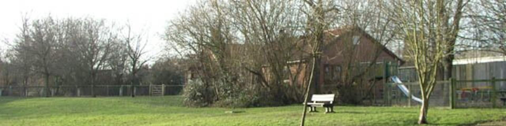 Hookwood Memorial Hall. Seen from the play area on the remains of Withy Meadow.