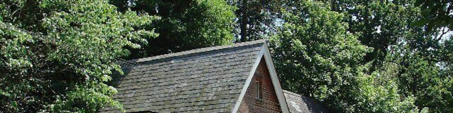 The John Flamsteed Hall, Burstow Church, Burstow, Surrey. Just over the road from the church. A plaque over the door states that the building was erected in 1859.