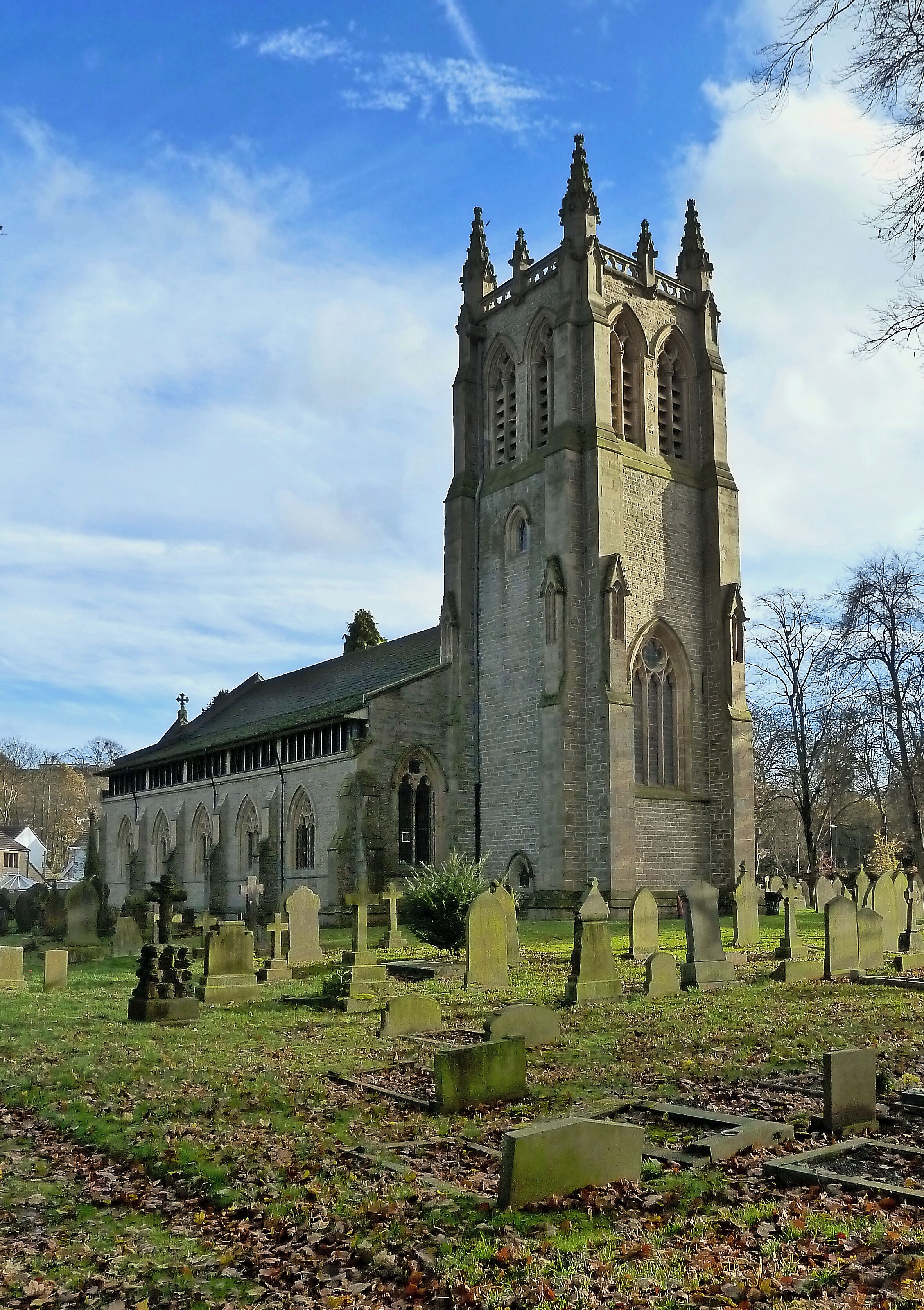 A historic church with a tall tower and arched windows.