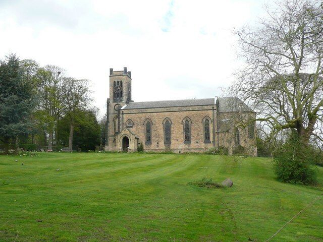 A church with a bell tower and arched windows.