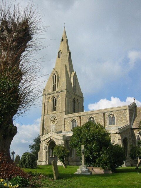 Nave, west tower and spire of All Saints parish church, Buckworth, Cambridgeshire (formerly Huntingdonshire), seen from the south