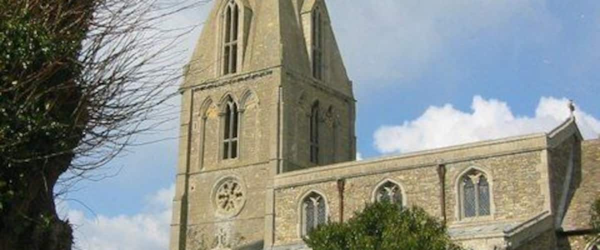 Nave, west tower and spire of All Saints parish church, Buckworth, Cambridgeshire (formerly Huntingdonshire), seen from the south