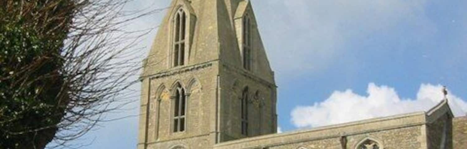 Nave, west tower and spire of All Saints parish church, Buckworth, Cambridgeshire (formerly Huntingdonshire), seen from the south