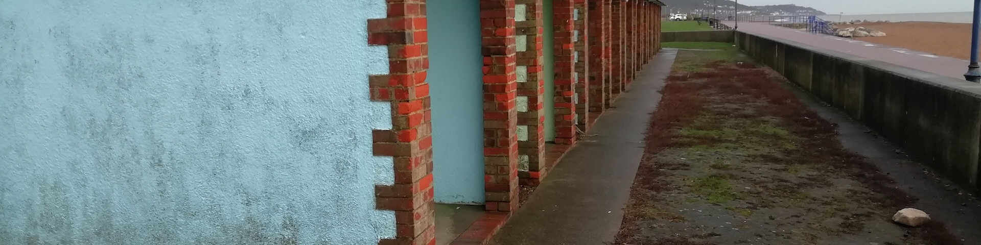 The beach huts on the seafront.